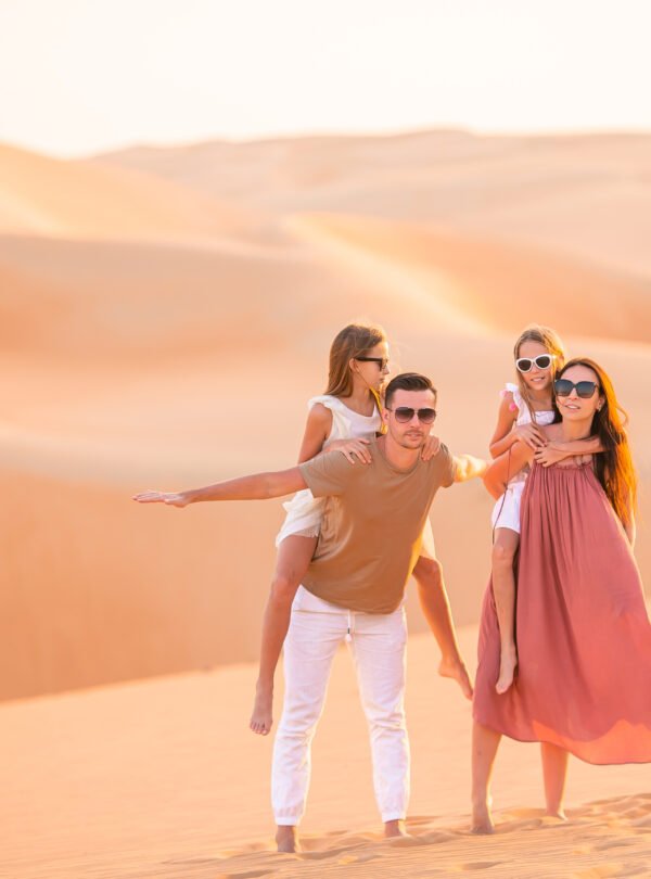 People among dunes in Rub al-Khali desert in United Arab Emirates